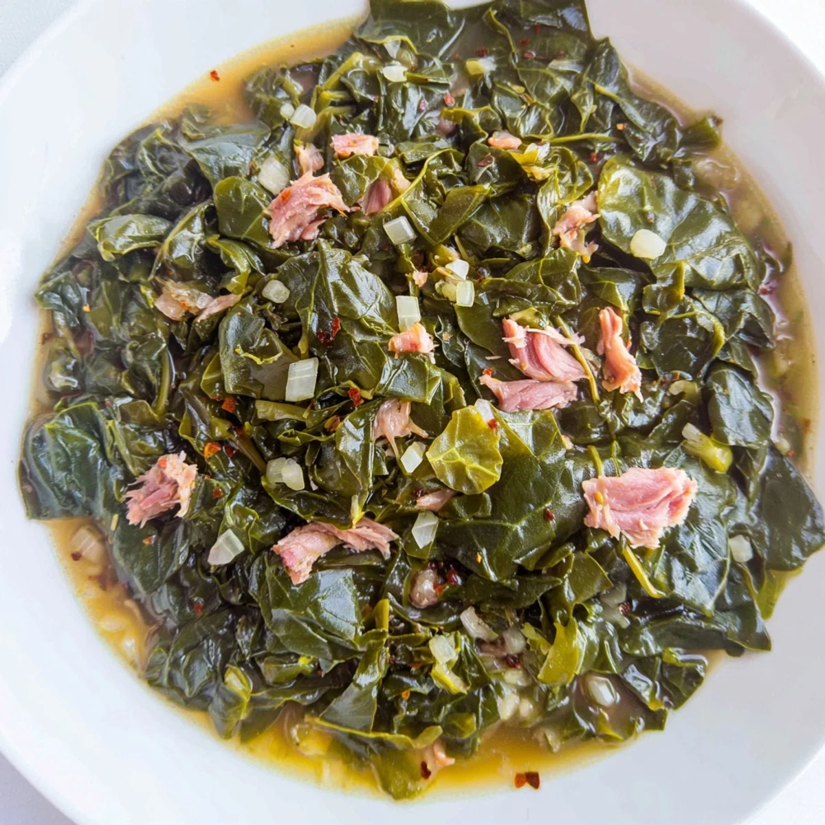 Tender, flavorful Rustic Southern Collard Greens with Smoked Turkey simmering slowly, creating a deeply savory stew.