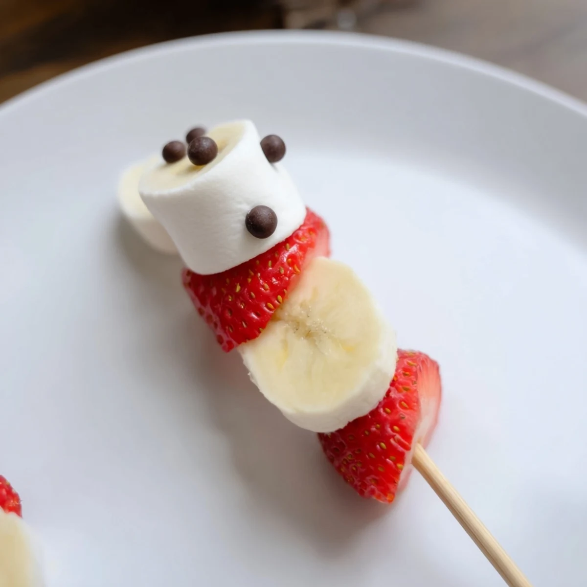 Festive Strawberry Banana Santa Sticks, a colorful snack with sweet strawberry hats and banana faces.