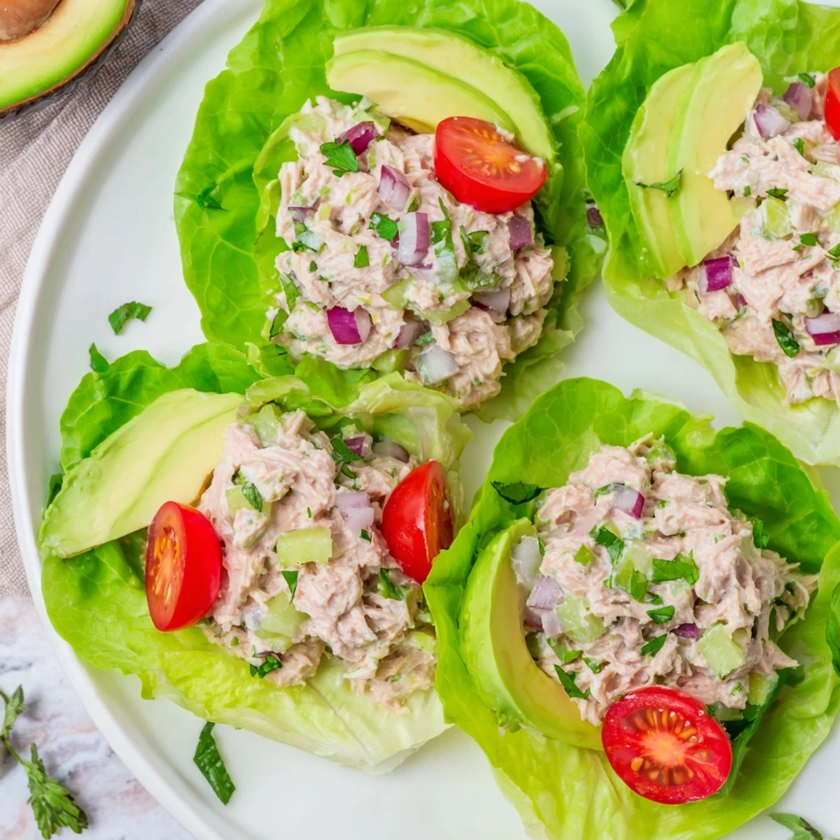Vibrant tuna salad lettuce wraps, filled with creamy tuna and fresh veggies, ready to enjoy.