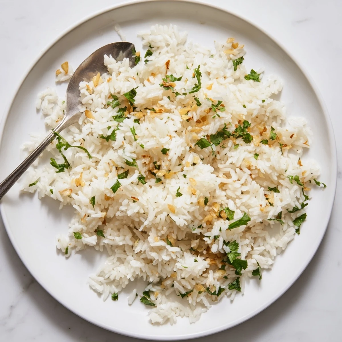 Delicate jasmine rice garlic cooked with aromatic garlic oil, perfect alongside stir-fries or grilled tofu, with soft, fragrant grains.