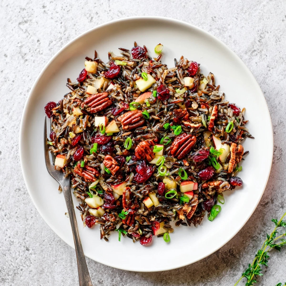 Serving Wild Rice Harvest Salad chilled, perfect for autumn dinners or festive holiday side dishes.