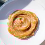 Golden Emirati Al Madrooba with glistening ghee, ready to be enjoyed with flatbread or a spoon.