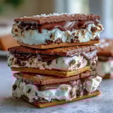 Rich vanilla bean ice cream layered with espresso-infused cookies, creating a decadent frozen dessert sandwich.  