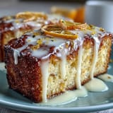 Zesty limoncello pound cake topped with tangy lemon glaze, offering a refreshing Italian-American dessert with vibrant flavor.