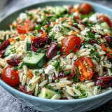 Bright Summer Orzo Salad with Feta, zesty lemon dressing glistens.