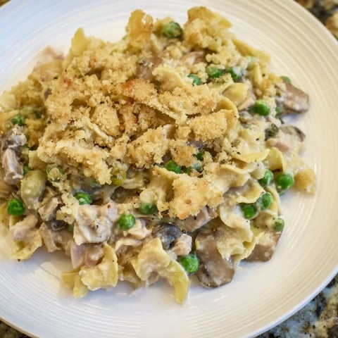 Golden, bubbly Homemade Tuna Noodle Casserole with a crispy Ritz cracker topping, ready to serve.