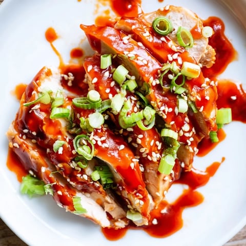 Sweet and Spicy Sriracha Honey Chicken: Glazed, tender chicken pieces glistening with that vibrant, spicy-sweet sauce.