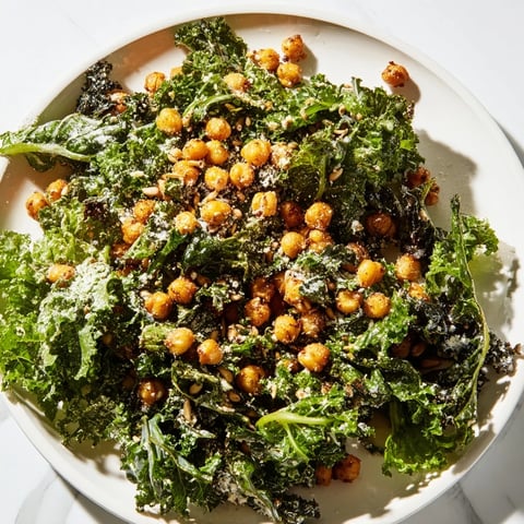 Warm Kale Salad with Crispy Chickpeas, a colorful dish with golden roasted chickpeas and vibrant kale.