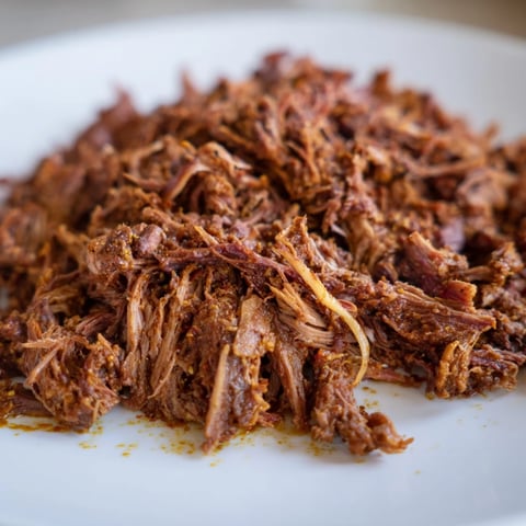 Tender Omani Shuwa, slow-cooked lamb in banana leaves, reveals savory, spiced aromas for dinner.