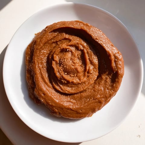 Creamy Emirati Al Madrooba, a rich spread of dates and ghee, perfect for breakfast with warm bread.