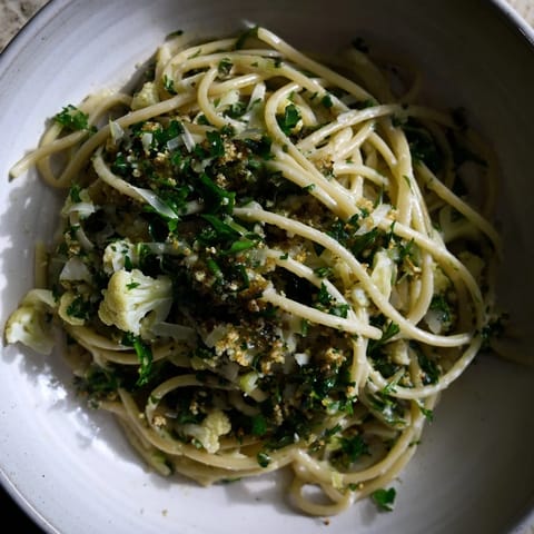 A creamy dream! This Creamy Roasted Cauliflower Garlic Pasta is sprinkled with fresh herbs and parmesan.