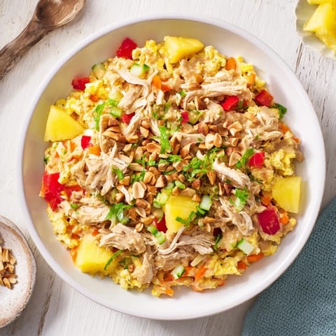 Savory Thai-Inspired Peanut Chicken Pasta, tossed in a creamy peanut sauce and fresh lime, ready to eat.