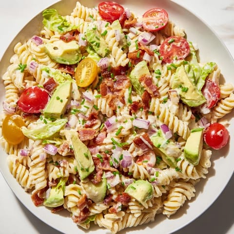 Refreshing BLT Pasta Salad: a summer dish featuring perfectly cooked pasta, bacon, and vibrant vegetables.