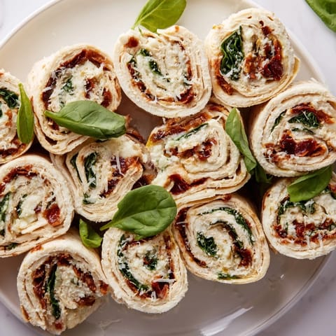 These vibrant sun-dried tomato turkey roll-ups offer a quick, satisfying Italian-inspired snack or lunch.
