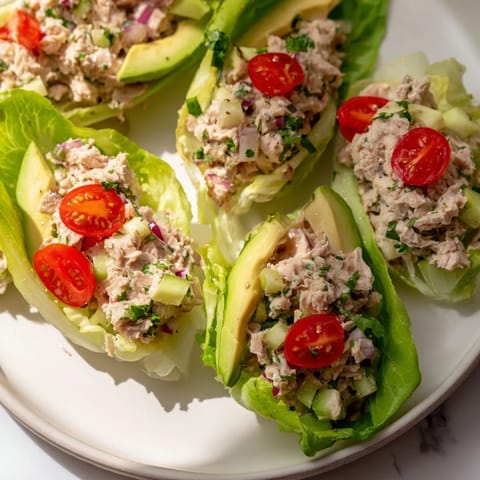 Cool, crisp butter lettuce cradles the savory tuna salad filling in these easy wraps.
