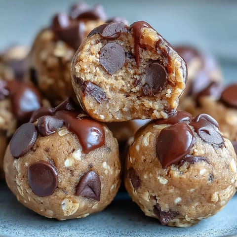A close-up shows the creamy texture of chickpea cookie dough bites studded with dark chocolate chips.