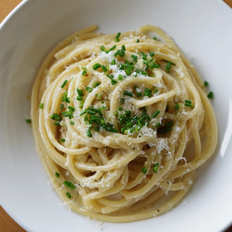 Delicious Miso Butter Pasta close-up shot: perfectly cooked spaghetti glistening with rich, umami butter.