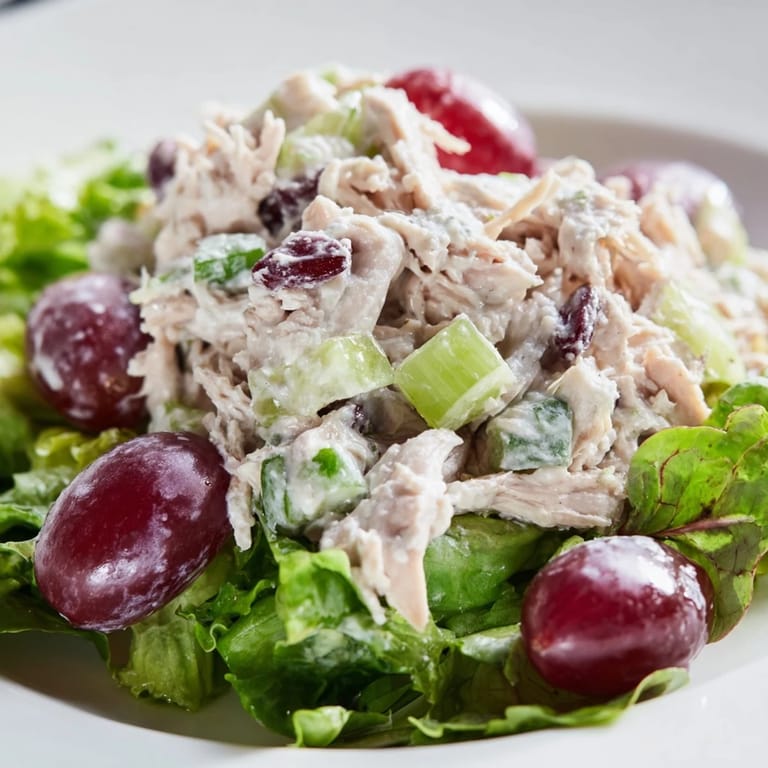 Fresh Crispy Chicken Salad: Imagine a bowl of tender chicken, vibrant greens, and grapes.
