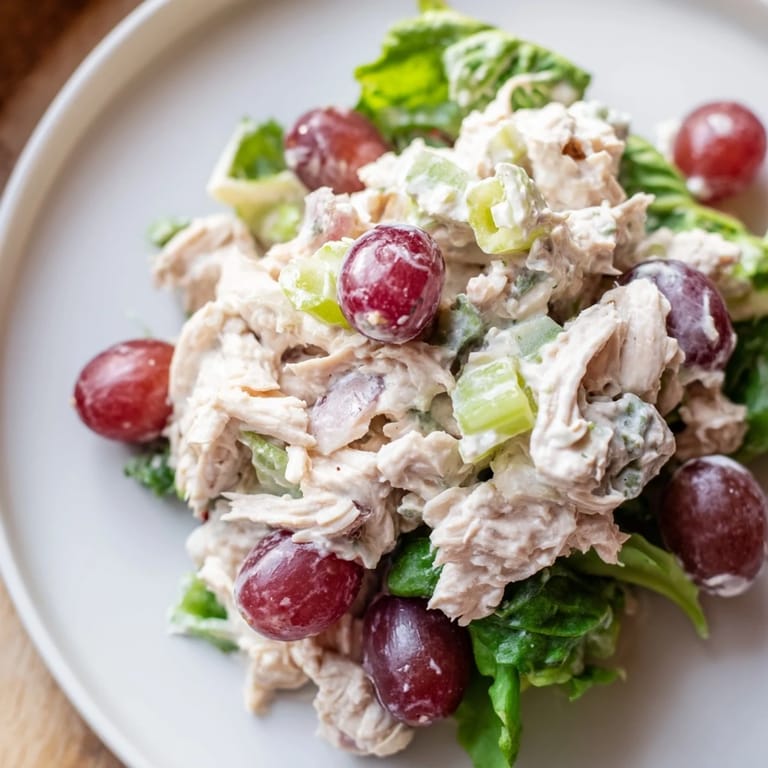 See a close-up of the delicious Crispy Chicken Salad bursting with flavor and texture.