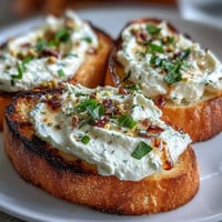 Buttery toasted sourdough topped with creamy whipped ricotta, honey drizzle, and crunchy pistachios.